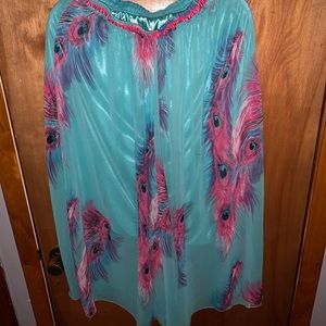 Long skirt with peacock feathers on it